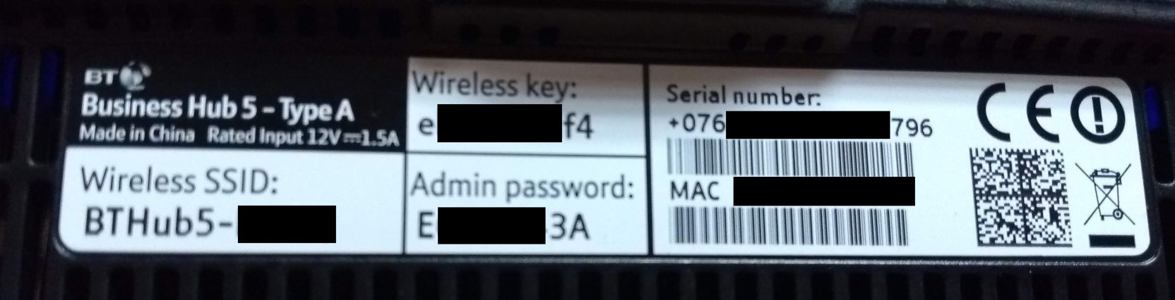 A photograph of the factory issued passwords for admin login and Wi-Fi from a home router.